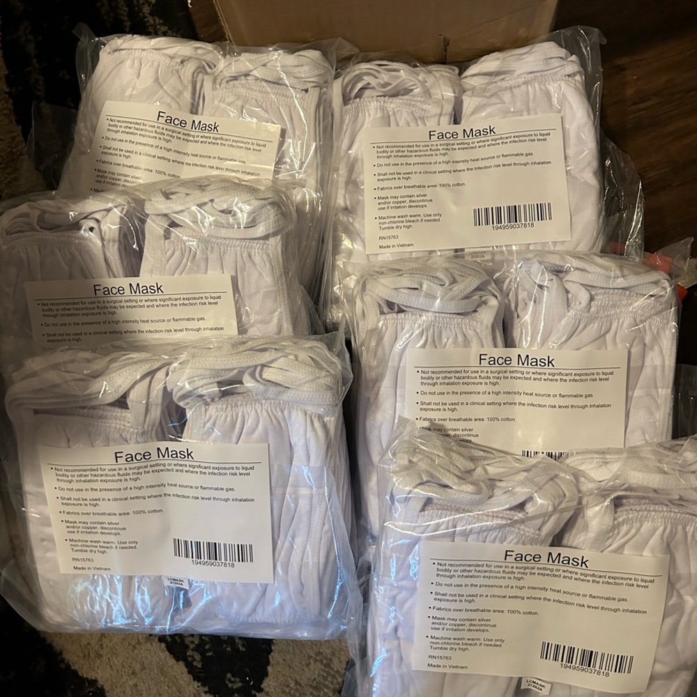 New in box white face masks